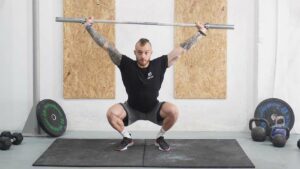 man overhead squat barbell